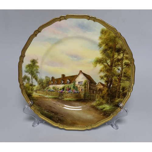 408 - A Royal Worcester plate painted with Mary Arden's House by E. Barker, signed, date mark for 1929... 