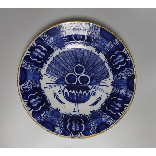 410 - A Dutch Delft blue and white dish, c.1760, painted with the Peacock pattern inside and ochre rim, ... 