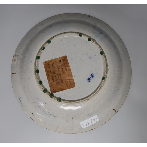 410 - A Dutch Delft blue and white dish, c.1760, painted with the Peacock pattern inside and ochre rim, ... 