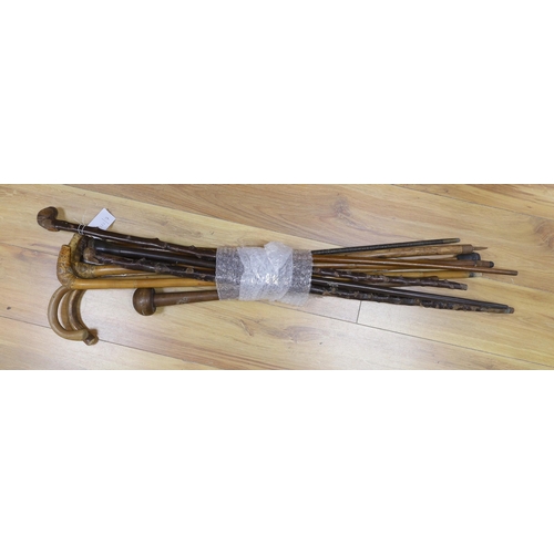 414 - Nine assorted walking sticks and canes and a knobkerrie