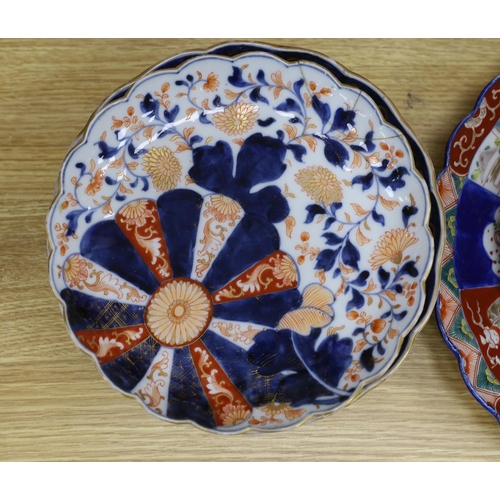 424 - Eleven Japanese Imari dishes and plates