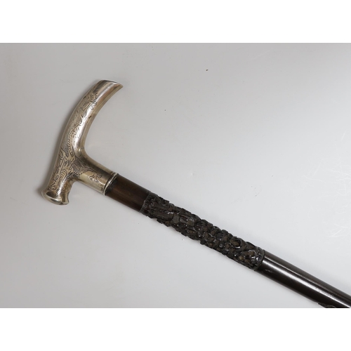 435 - A Chinese silver mounted carved hongmu walking stick, 92cm