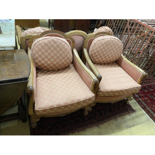 52 - An early 20th century faded mahogany three piece suite, settee length 163cm, depth 85cm, height 80cm... 