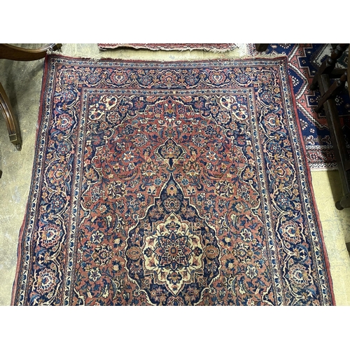 53 - An Isphahan red ground rug, 206 x 133cm together with a Bokhara red ground runner