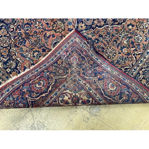 53 - An Isphahan red ground rug, 206 x 133cm together with a Bokhara red ground runner