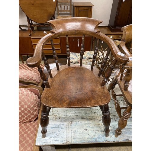 54 - A Victorian elm and beech smoker's bow elbow chair, width 60cm, depth 49cm, height 84cm