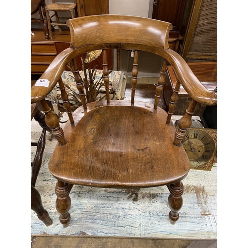 55 - A Victorian elm and beech smoker's bow elbow chair, width 63cm, depth 52cm, height 78cm