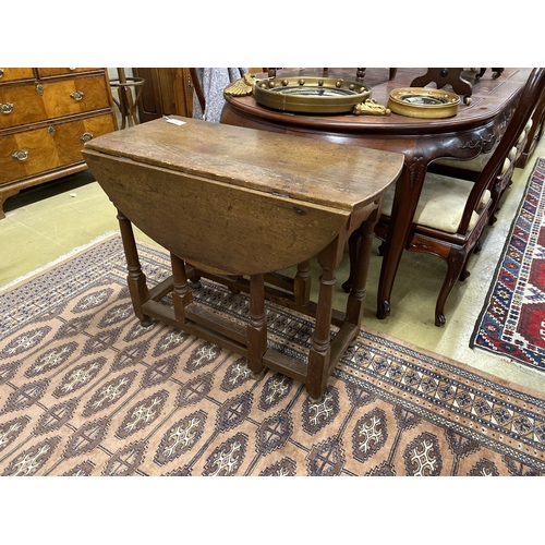 65 - An 18th century oak gateleg table, width 90cm, depth 43cm, height 72cm