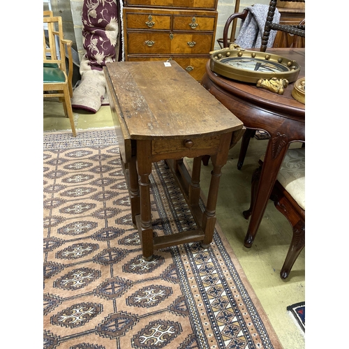 65 - An 18th century oak gateleg table, width 90cm, depth 43cm, height 72cm