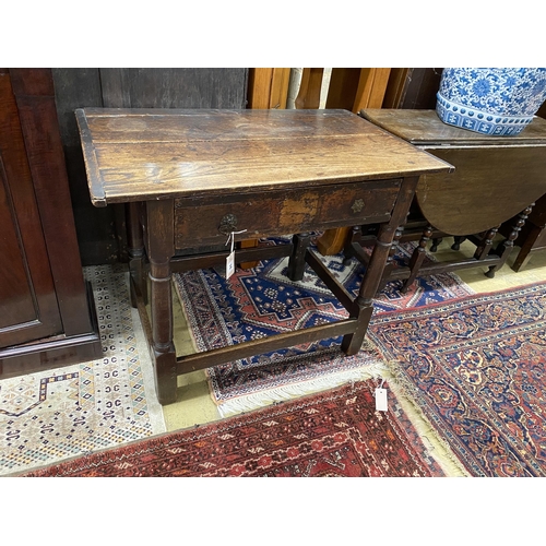 74 - An 18th century oak two drawer side table, width 91cm, depth 56cm, height 70cm