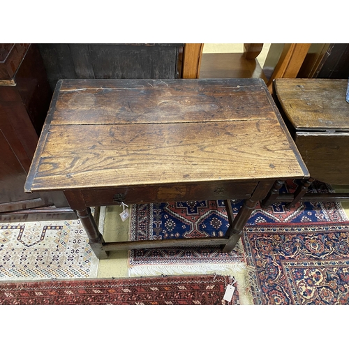 74 - An 18th century oak two drawer side table, width 91cm, depth 56cm, height 70cm