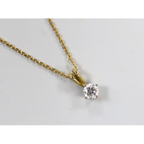 980 - A modern 18ct gold and solitaire diamond set pendant, 10mm, on an 18ct gold chain, 40cm, gross weigh... 