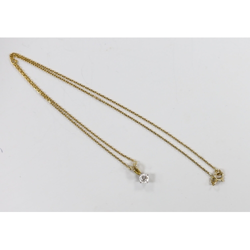 980 - A modern 18ct gold and solitaire diamond set pendant, 10mm, on an 18ct gold chain, 40cm, gross weigh... 