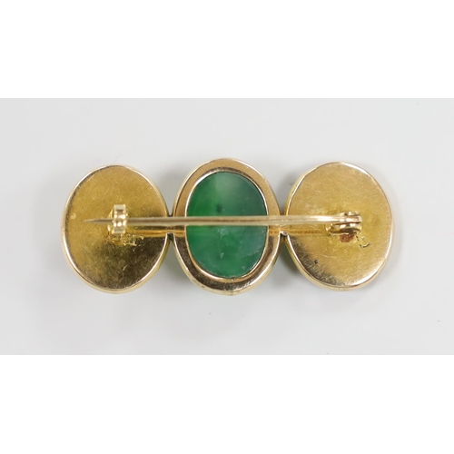 982 - A Chinese yellow metal and cabochon jade and Chinese character set triple oval motif brooch,  39mm, ... 