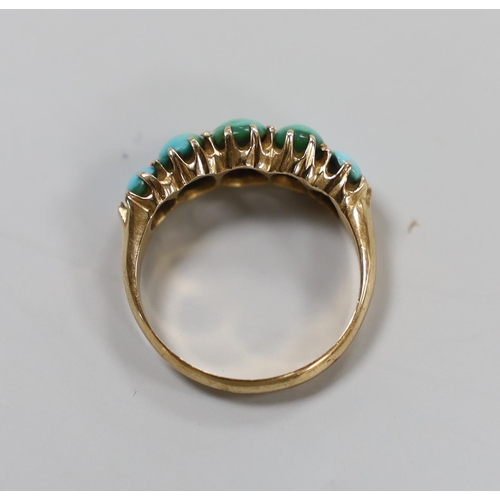 987 - A yellow metal and graduated five stone cabochon turquoise set half hoop ring, size G/H, gross weigh... 