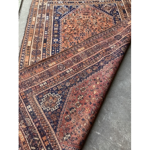 1003 - A Hamadan faded red ground rug, 260 x 160cm