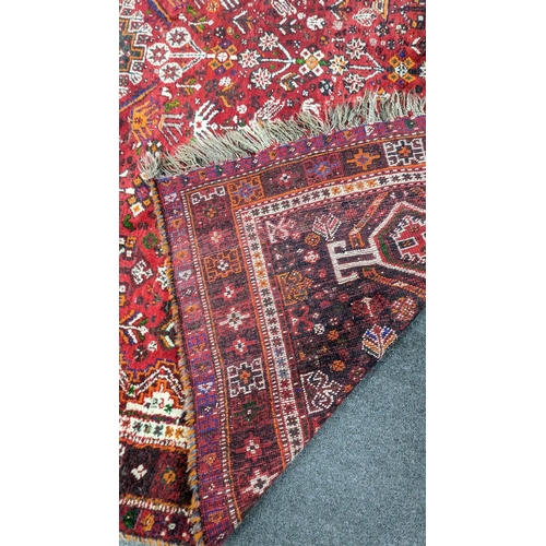 1233A - A Hamadan red ground carpet, 294 x 216cm