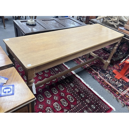 1235A - A narrow rectangular topped light oak table, width 180cm, depth 58cm, height 76cm