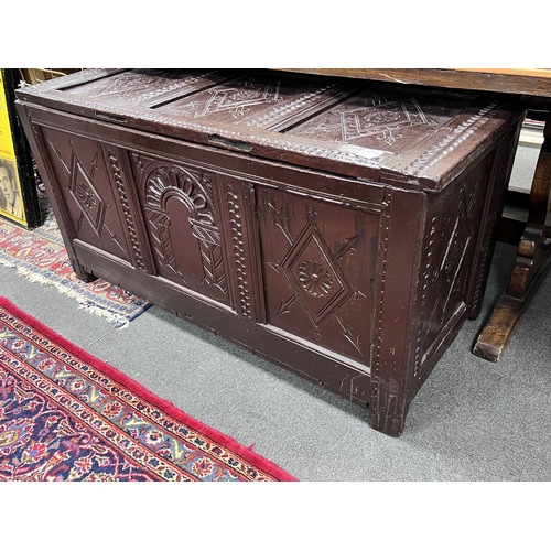 1237 - A 17th century later carved oak coffer, width 132cm