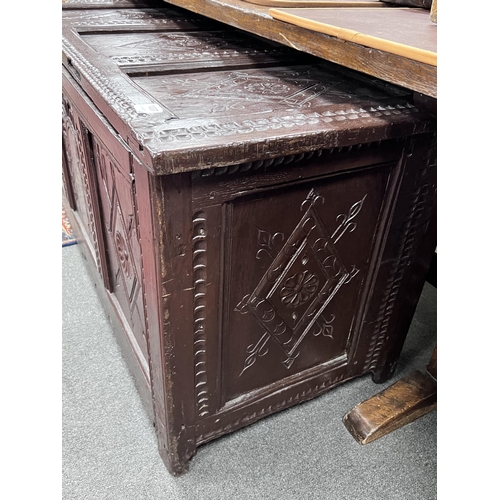 1237 - A 17th century later carved oak coffer, width 132cm