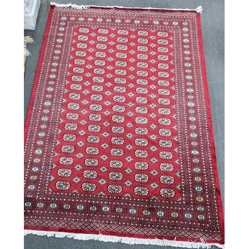 1237A - A Bokhara red ground carpet, 280 x 194cm
