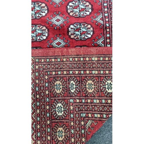 1237A - A Bokhara red ground carpet, 280 x 194cm