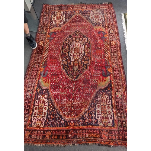 1246 - A Caucasian red ground carpet 260cm x 160cm.
