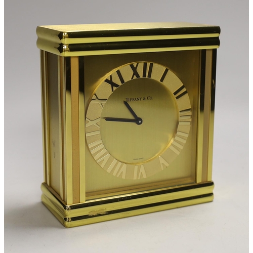 1252 - A Tiffany & Co. Swiss made brass clock, 14cm wide, 15.5cm high