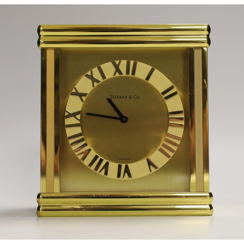 1252 - A Tiffany & Co. Swiss made brass clock, 14cm wide, 15.5cm high