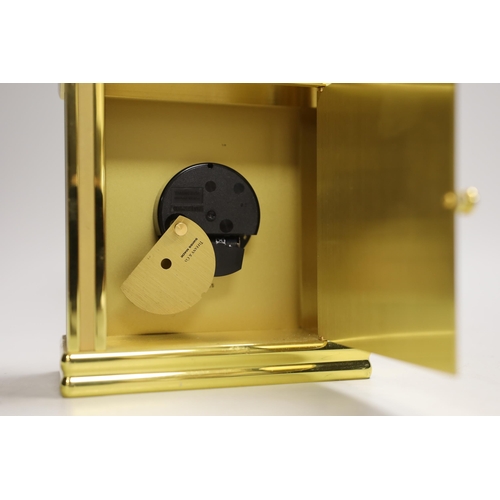 1252 - A Tiffany & Co. Swiss made brass clock, 14cm wide, 15.5cm high