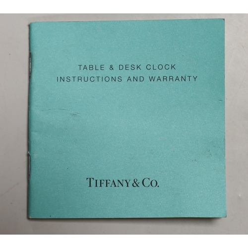 1252 - A Tiffany & Co. Swiss made brass clock, 14cm wide, 15.5cm high