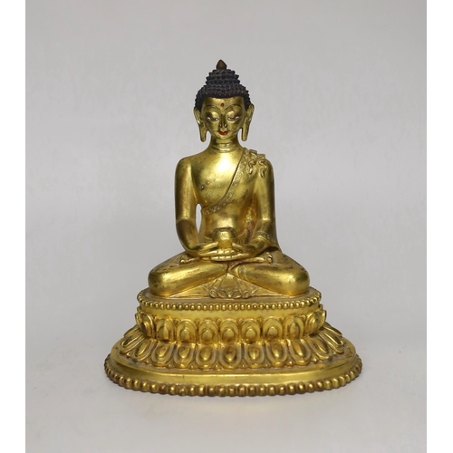 1260 - A Sino-Tibetan gilt bronze figure of Buddha Shakuamuni, 16cm
