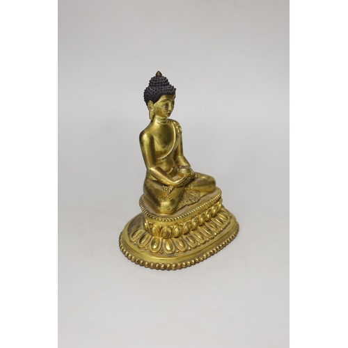 1260 - A Sino-Tibetan gilt bronze figure of Buddha Shakuamuni, 16cm