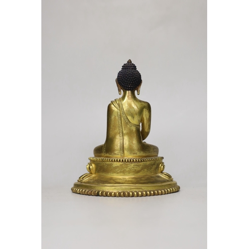 1260 - A Sino-Tibetan gilt bronze figure of Buddha Shakuamuni, 16cm
