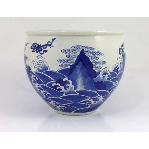 100 - A Chinese blue and white mythical beasts jardiniere, Kangxi period, the moulded rim above an ovoid... 