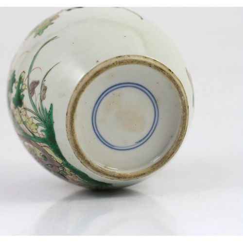 107 - A Chinese famille verte small ovoid jar, Kangxi period, painted with rocks, flowers, foliage and two... 