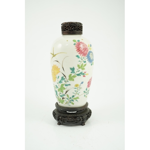 109 - A Chinese famille rose ovoid vase, Yongzheng period, painted with chrysanthemums, peonies, a butterf... 