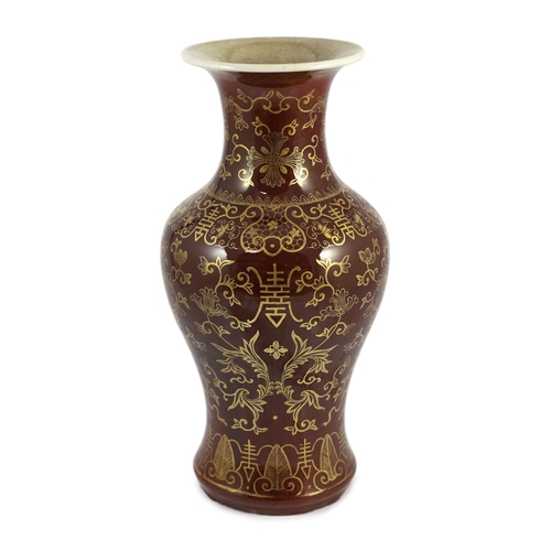 115 - An unusual Chinese gilded flambé baluster vase, 19th century, the streaked ox blood glaze gilt decor... 