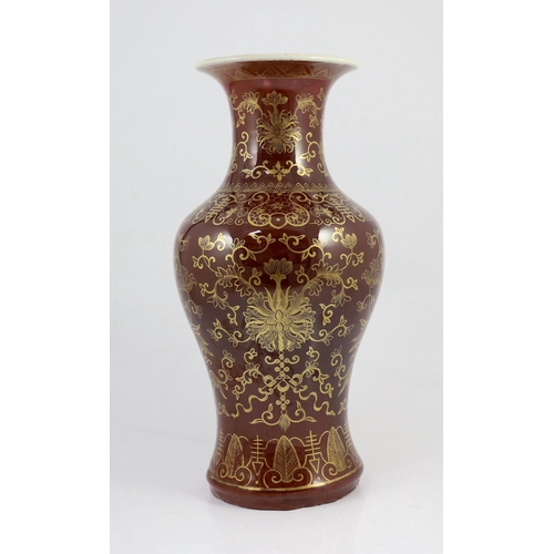 115 - An unusual Chinese gilded flambé baluster vase, 19th century, the streaked ox blood glaze gilt decor... 