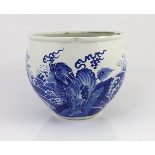 100 - A Chinese blue and white mythical beasts jardiniere, Kangxi period, the moulded rim above an ovoid... 