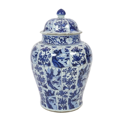 106 - A massive Chinese blue and white jar and cover, Kangxi period, painted with alternating landscape an... 