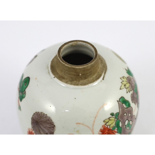 107 - A Chinese famille verte small ovoid jar, Kangxi period, painted with rocks, flowers, foliage and two... 