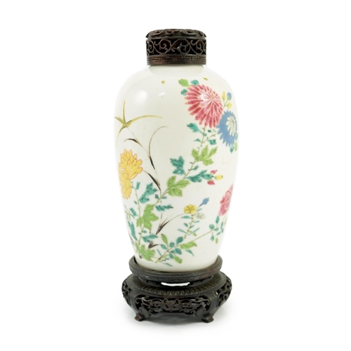 109 - A Chinese famille rose ovoid vase, Yongzheng period, painted with chrysanthemums, peonies, a butterf... 