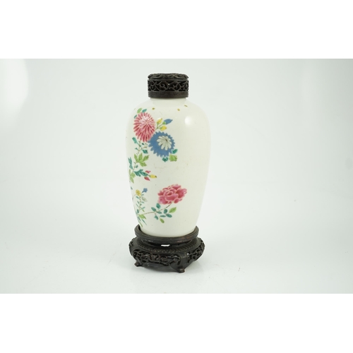 109 - A Chinese famille rose ovoid vase, Yongzheng period, painted with chrysanthemums, peonies, a butterf... 