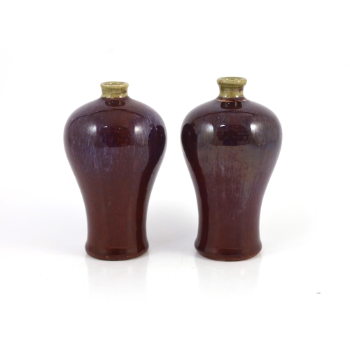 114 - A near pair of Chinese flambé glazed meiping, 18th century, each mushroom coloured neck above a purp... 