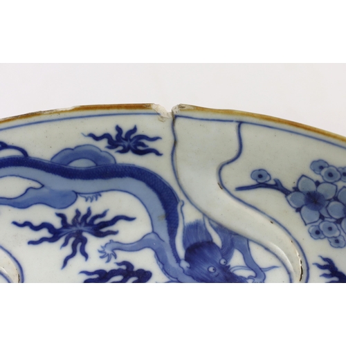 117 - A pair of Chinese blue and white armorial dishes in Japanese Kakiemon style, Qianlong period, c.1752... 