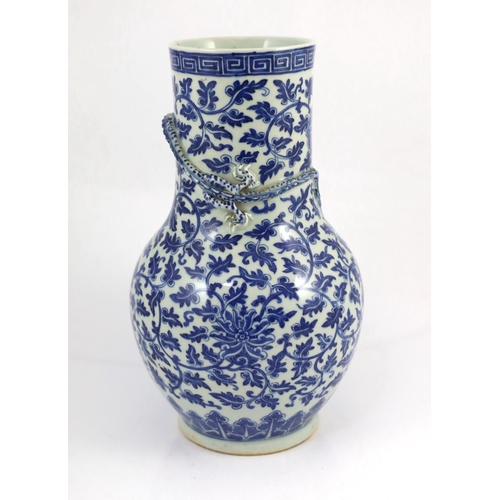 118 - A Chinese blue and white lotus vase, first half 19th century, the cylindrical neck modelled in rel... 