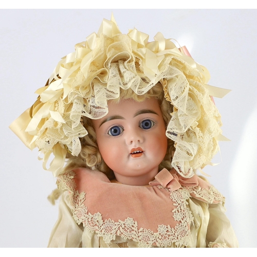 13 - A fine and rare Frederick Edmund Winkler bisque doll, in original box, German, circa 1894-1899, the ... 