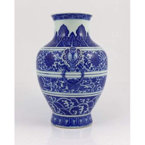 135 - A Chinese blue and white lotus vase, hu, Qianlong seal mark but Republic period, moulded with a pa... 