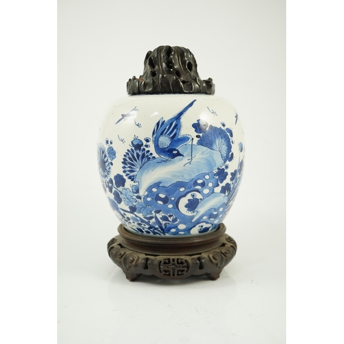 138 - A Chinese blue and white birds and rockwork ovoid jar, Kangxi period, painted with three birds in ... 